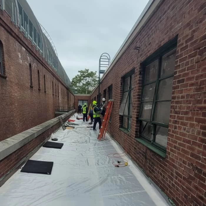 Green Island Group Corp masons constructing a brick wall for residential or commercial building