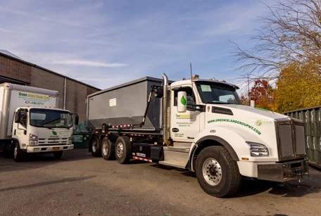 Green Island Group Corp fleet of trucks ready for construction, demolition, and restoration services