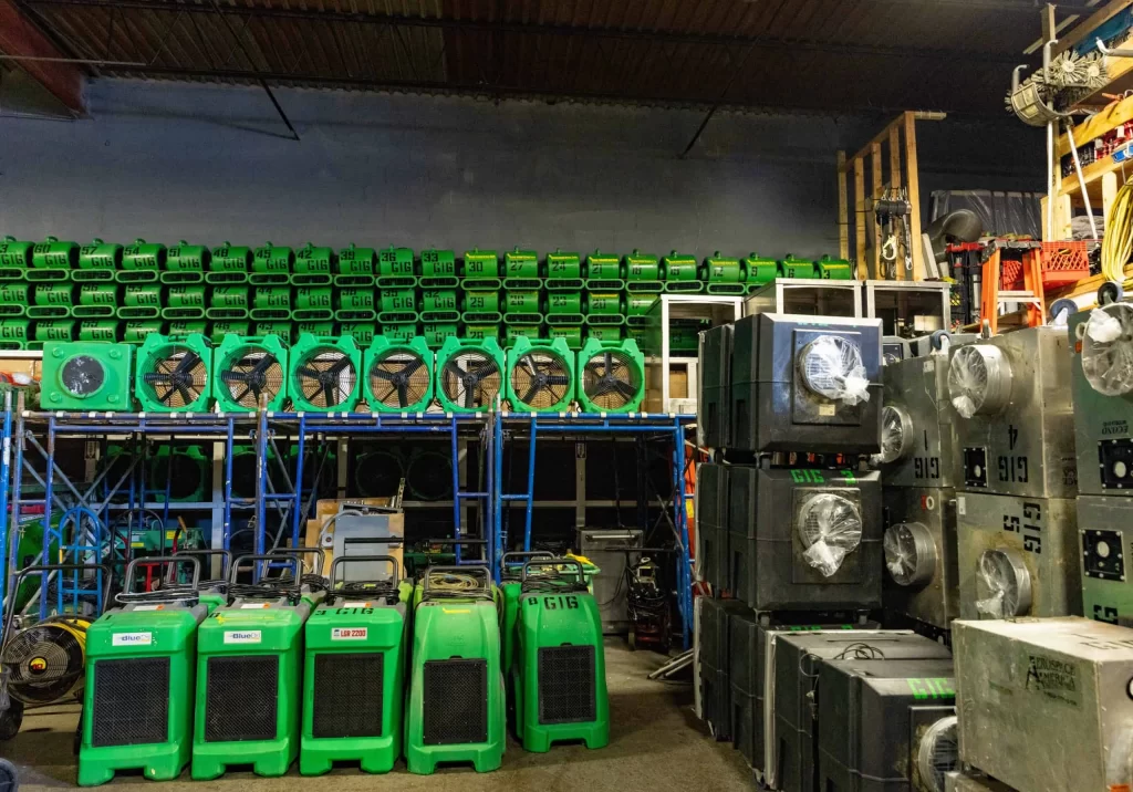 Water damage restoration equipment staged in Green Island Group Corp yard for emergency response deployment