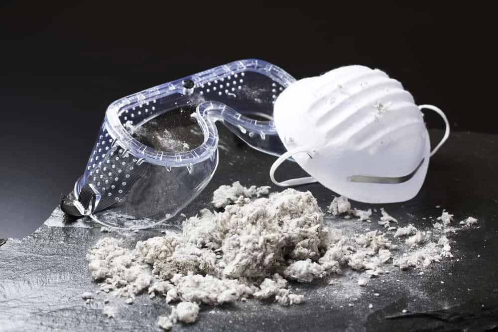 Protective face shield and mask designed for asbestos removal and hazardous material safety.