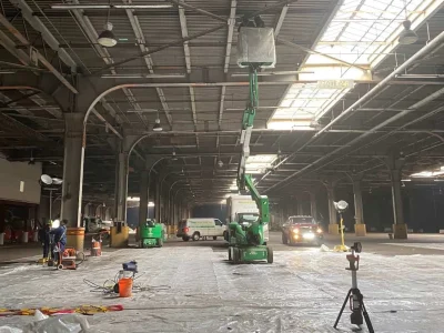 Green Island Group Corp installing or repairing industrial roofing on large commercial facility